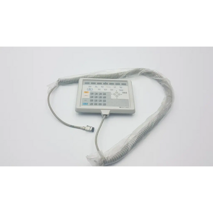 Gray plastic handheld hewlett packard m1106c patient monitor keyboard with coiled cable and usb connector