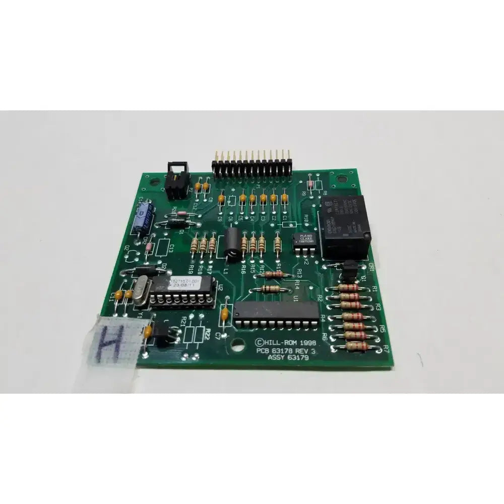 Green printed circuit board control mother board pcb hill-rom 1998 with electronic components mounted on it