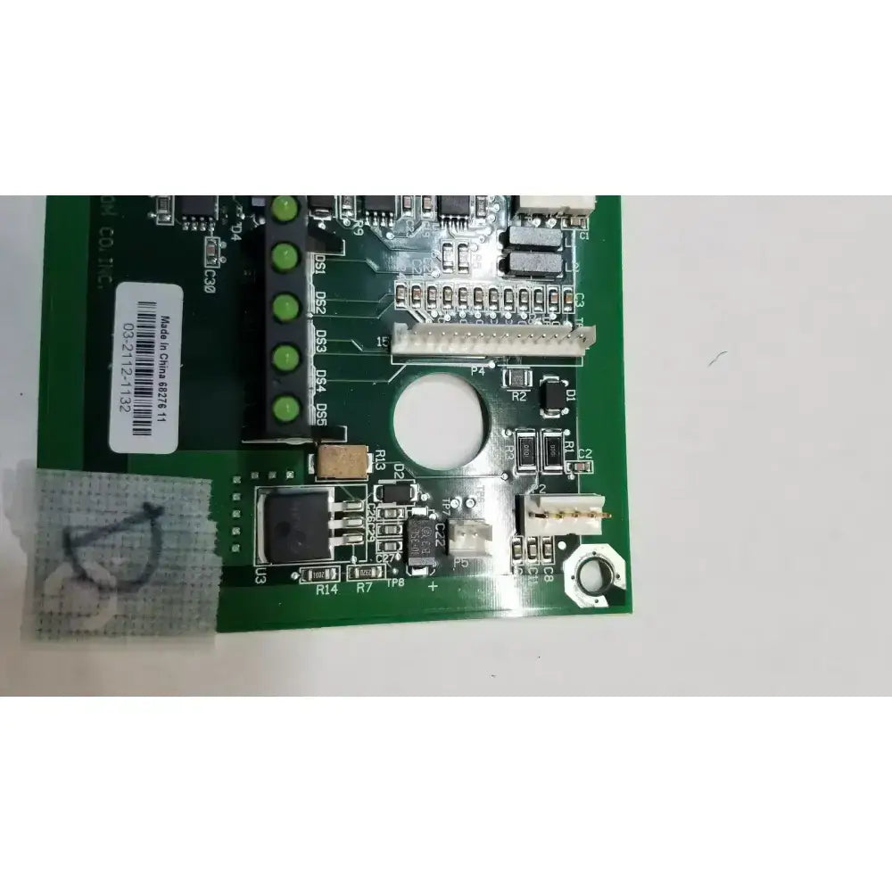 Green printed circuit board with electronic components and white label for hill-rom light relay control mother board