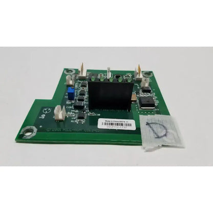 Green printed circuit board with black rectangular component and various electronic parts in hill-rom 2001 light relay control mother board
