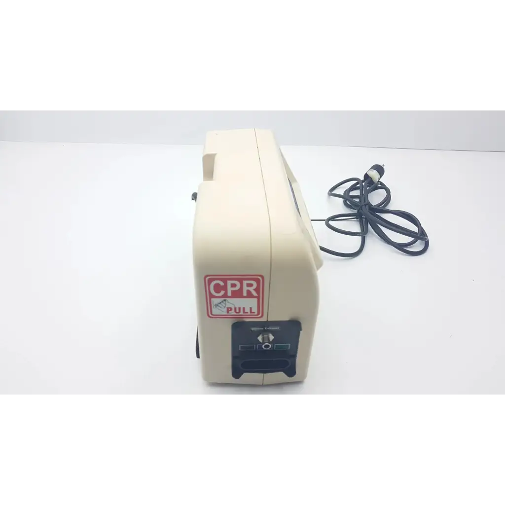 Beige cpr training manikin with red and white cpr pull label next to hill-rom mdq-79r0 synergy air elite air mattress pump
