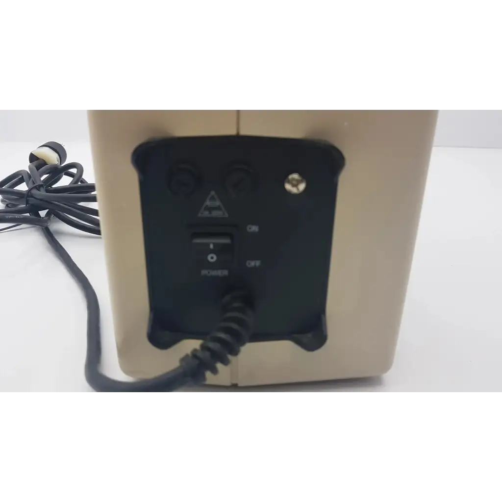 Beige rectangular speaker with black control panel and knobs on the back of hill-rom synergy air elite air mattress pump