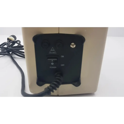Beige rectangular speaker with black control panel and knobs on the back of hill-rom synergy air elite air mattress pump