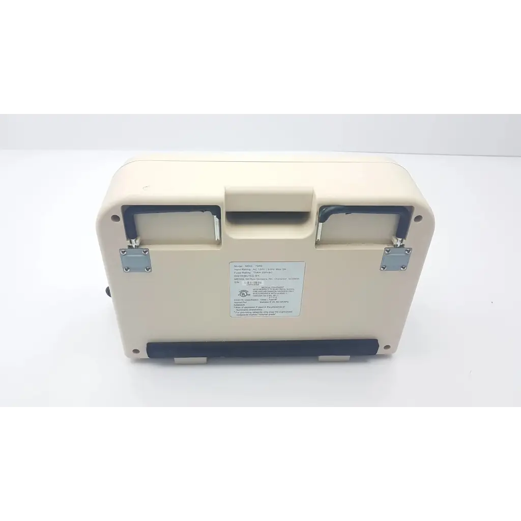 Cream-colored synergy air elite air mattress pump with black rubber trim and metallic latches for medical use