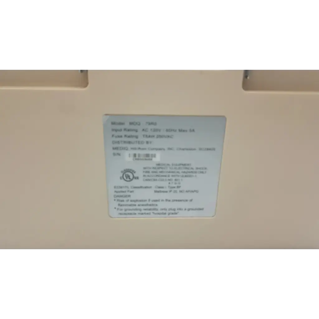 White rectangular label with black text and a circular certification mark on hill-rom synergy air elite air mattress pump