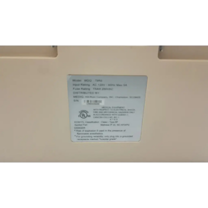 White rectangular label with black text and a circular certification mark on hill-rom synergy air elite air mattress pump