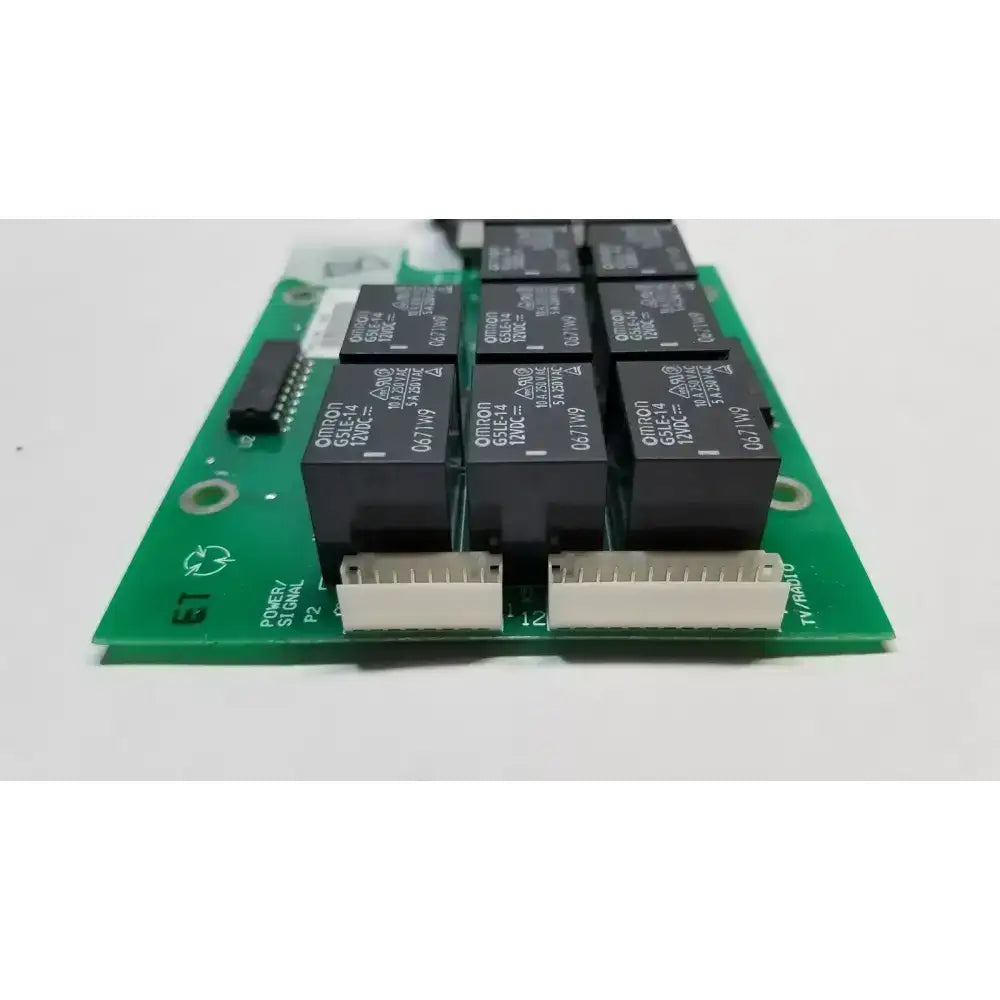 Green printed circuit board with black relay modules and white connectors for hill rom total ent light control board