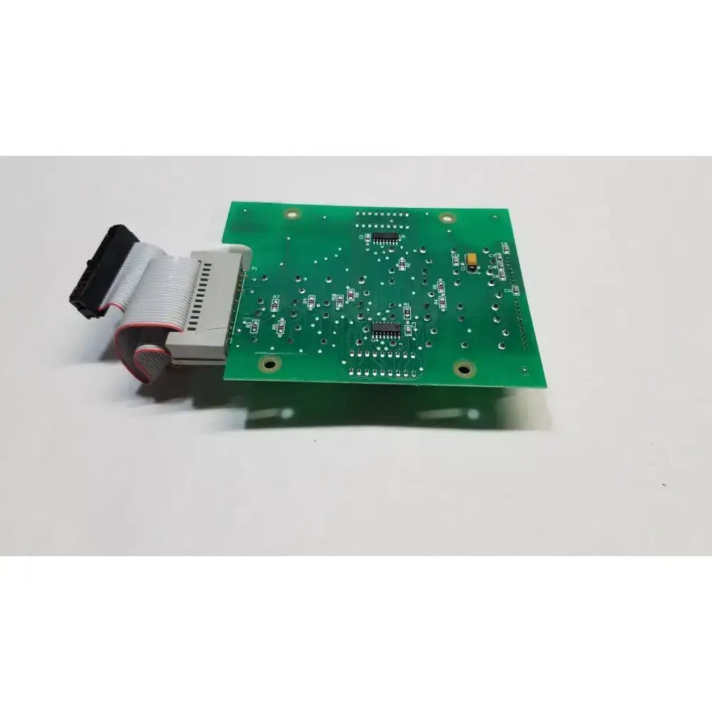 Green rectangular hill rom total care control board with integrated components and gray ribbon cable for ent light use