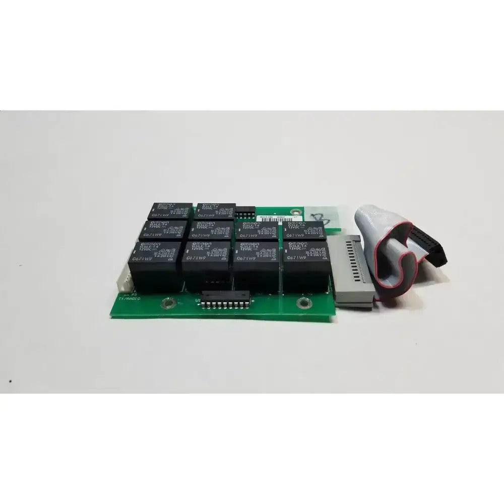 Green hill rom total care control board with black relay modules and gray connector cable for ent light system