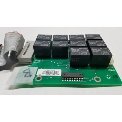 Green printed circuit control board with black relay modules and gray ribbon cable for hill rom total ent light use