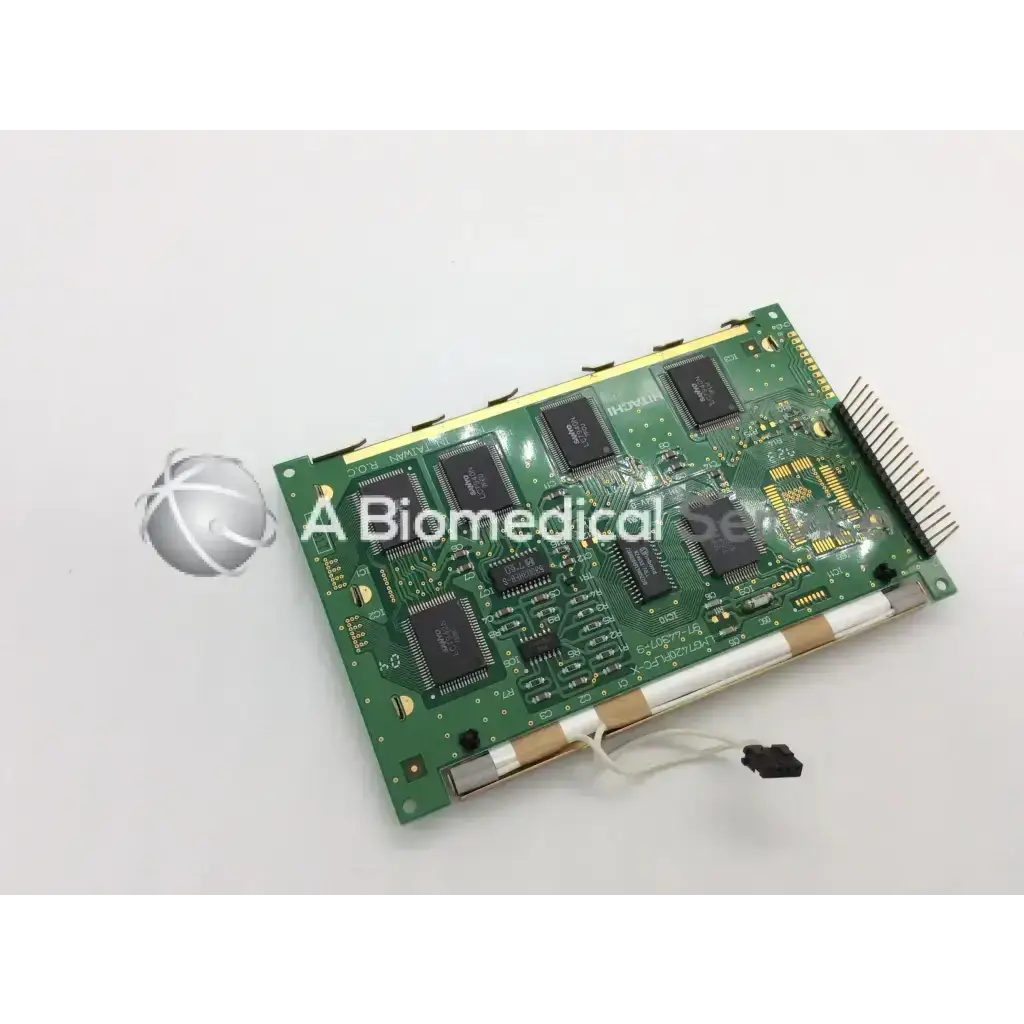 Green rectangular circuit board with black integrated circuits and gold connectors for hitachi lcd screen display panel
