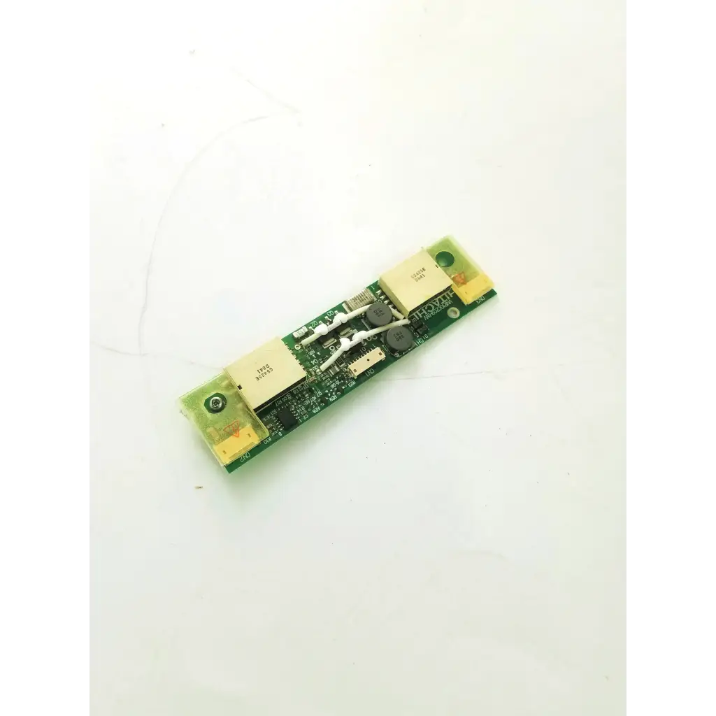 Green hitachi vnr10c209-inv inverter board with beige rectangular components and white capacitors on circuit board