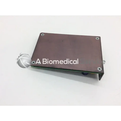 Brown rectangular hologic qdr explorer motor control board with silver screws and green qdr4500 circuit edge visible