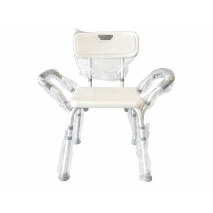 White plastic shower chair with silver metal frame biomed certified padded armrests still wrapped in protective plastic
