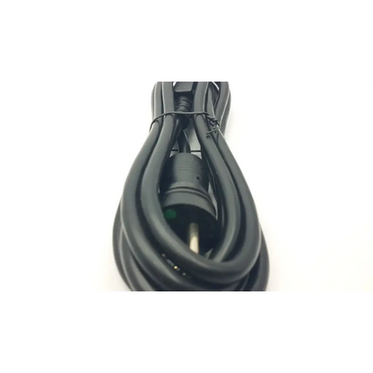 Black hospital grade green dot power cord cable with three prong plug coiled and secured by a tie