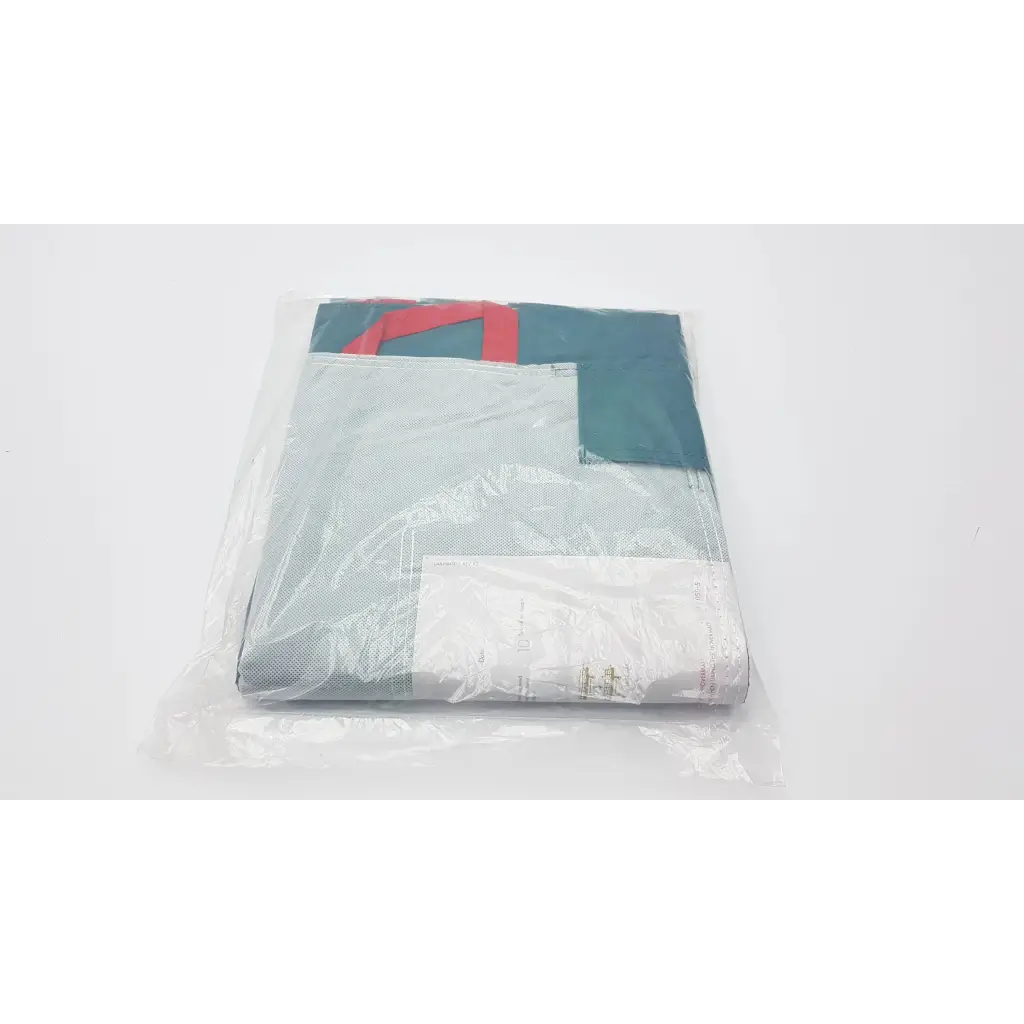 Packaged teal and gray hovermatt lateral transfer air mattress with red geometric design wrapped in clear plastic