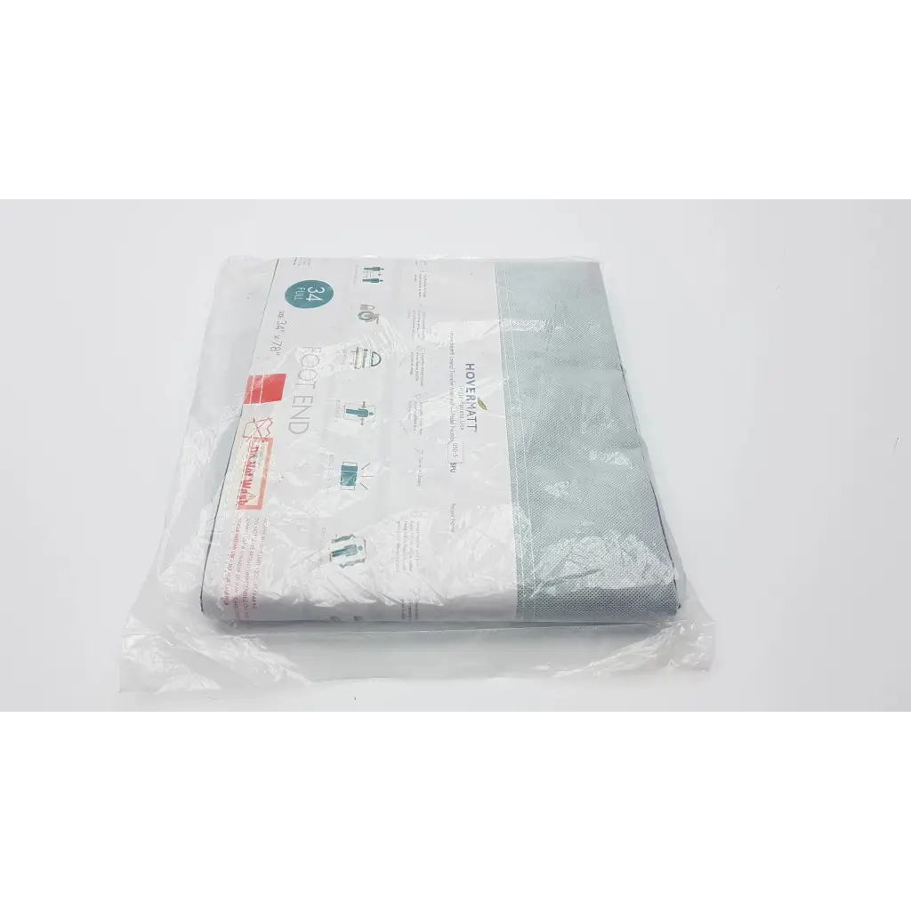 Packaged light gray woven fabric lateral transfer air mattress by Hovermatt for single-patient use measuring 34 by 78 inches