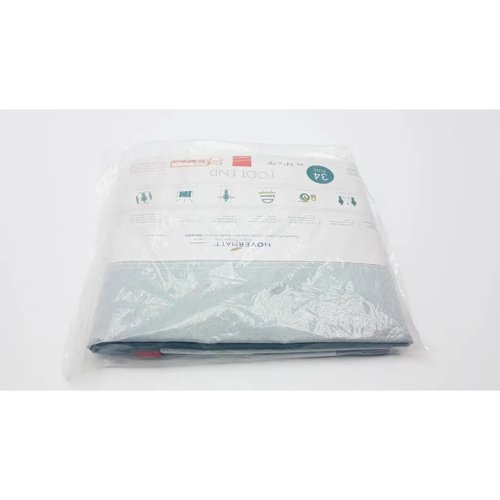 A light gray fabric lateral transfer air mattress foot end cover in clear packaging with hovermat label and product details