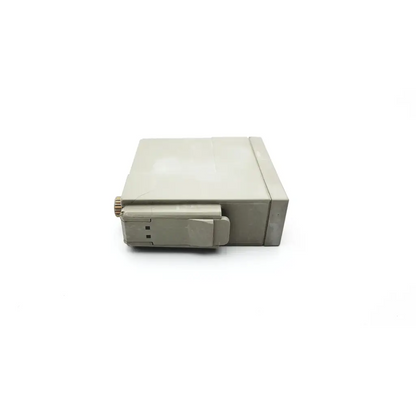 Beige plastic hp m1012a cardiac output module with small metal knob and hinged flap for cardiac monitoring