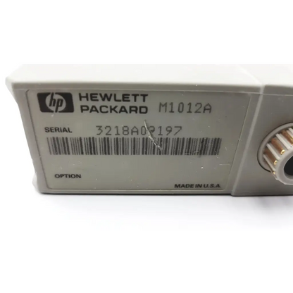 Gray hp hewlett packard m1012a cardiac output module cartridge with barcode and serial number label visible