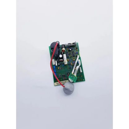 Green circuit board with electronic components and red wire connected to hp codemaster power supply m1722-60130 nibp assembly board