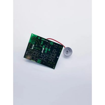 Green printed circuit board with silver components and red wire connected to buzzer in hp codemaster power supply M1722-60130