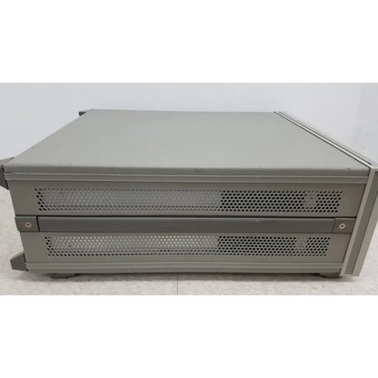 Gray metal server rack with perforated panels showcasing hewlett packard 4284a precision lcr meter design