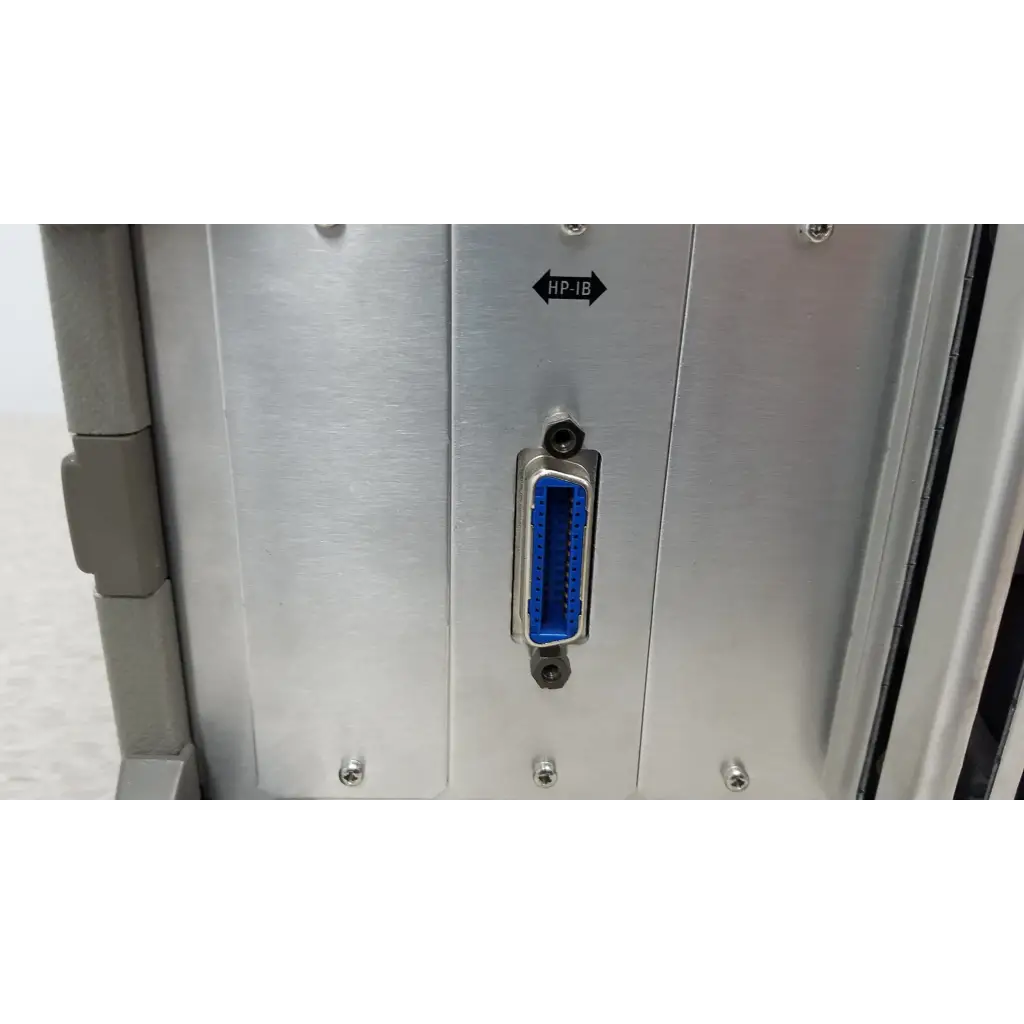 Blue hp-ib connector mounted on a silver panel on the back of a hewlett packard 4284a precision lcr meter