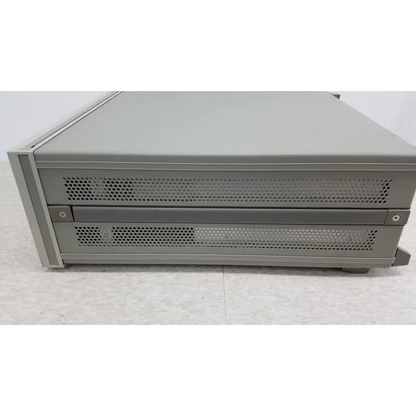 Gray metal server rack with perforated front panels and two drawers for hewlett packard precision lcr meter 4284a