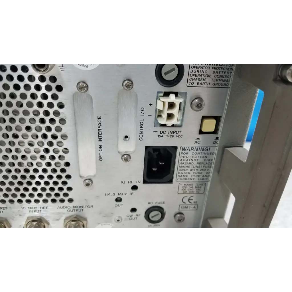White metal hewlett packard 8920a multifunctional test instrument back with perforated panel and power i o ports