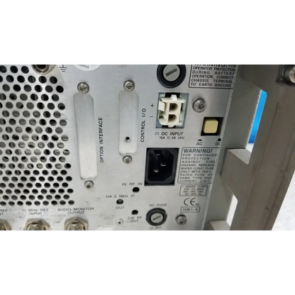 White metal hewlett packard 8920a multifunctional test instrument back with perforated panel and power i o ports