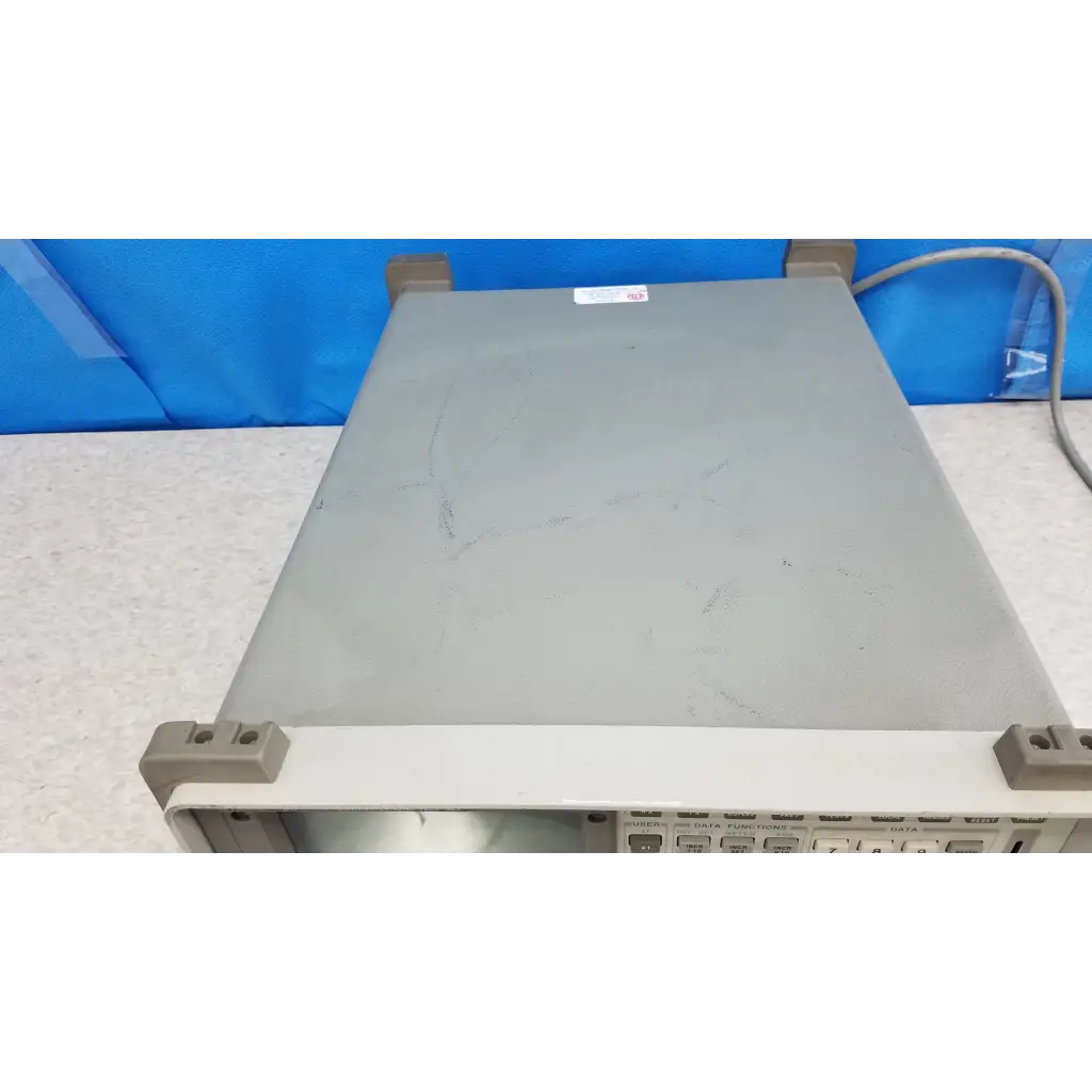 Gray metallic Hewlett Packard 8920A communications test set with beige trim and label for rf communications testing