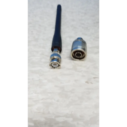 Blue antenna with metallic connector and silver bnc plug on hewlett packard 8920a communications test set