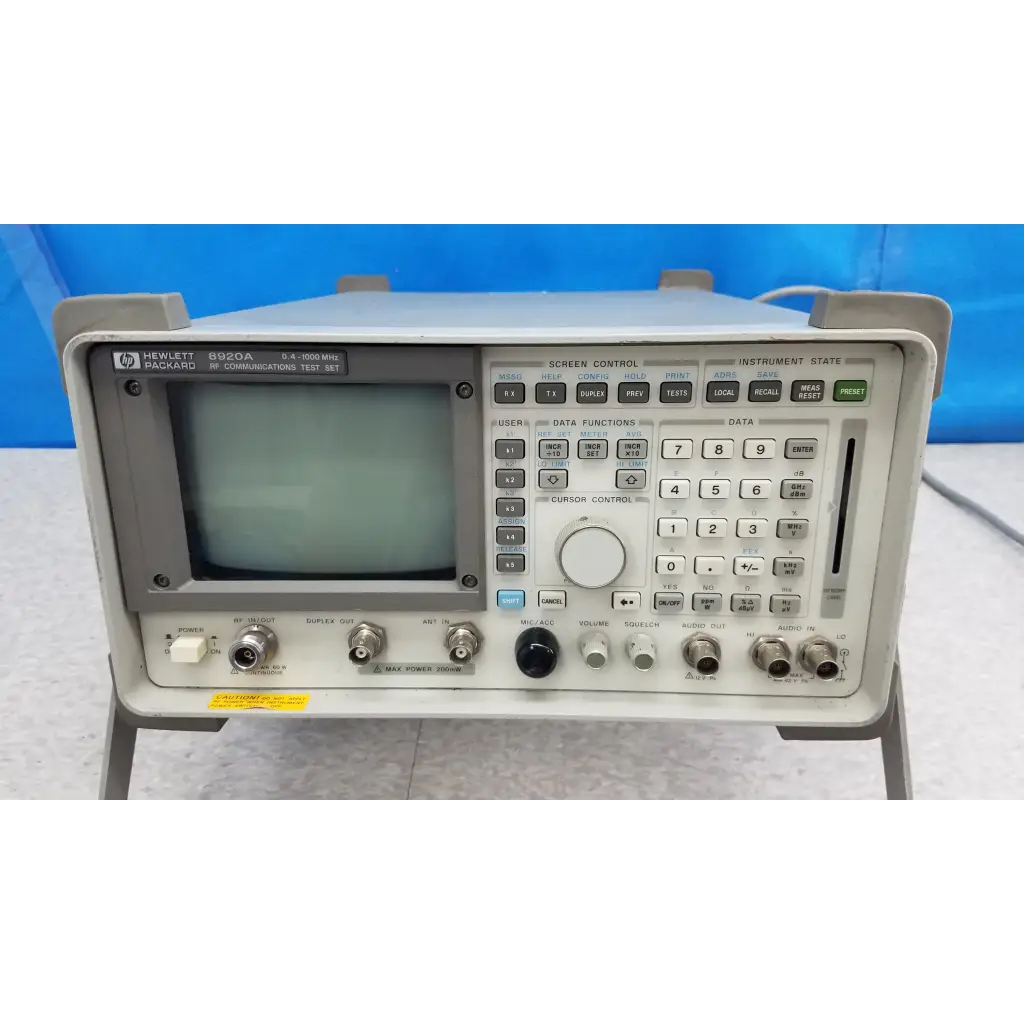 Gray hewlett packard 8920a communications test set with small screen and numerous control buttons for rf communications test