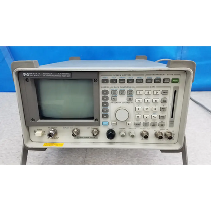 Gray hewlett packard 8920a communications test set with small screen and numerous control buttons for rf communications test