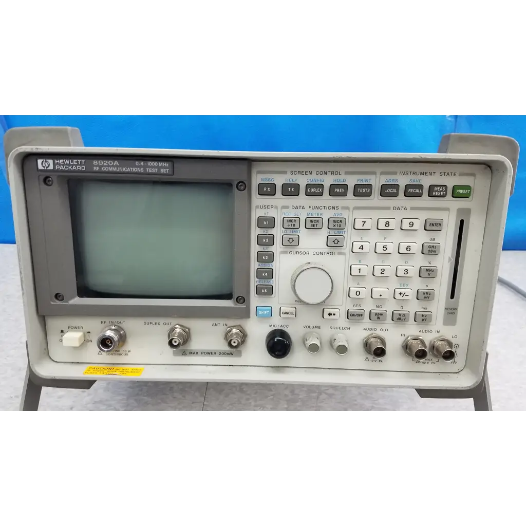Gray hewlett packard 8920a rf communications test set with small screen and multiple control buttons for communications test