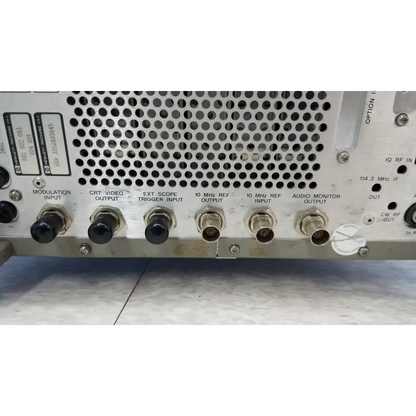 Rear panel of silver metallic hewlett packard 8920a communications test set with bnc connectors and ventilation holes
