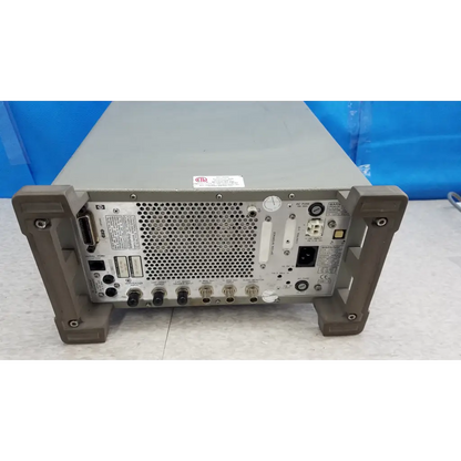 Gray metal rack-mountable hewlett packard 8920a communications test set back panel with multiple ports and perforations