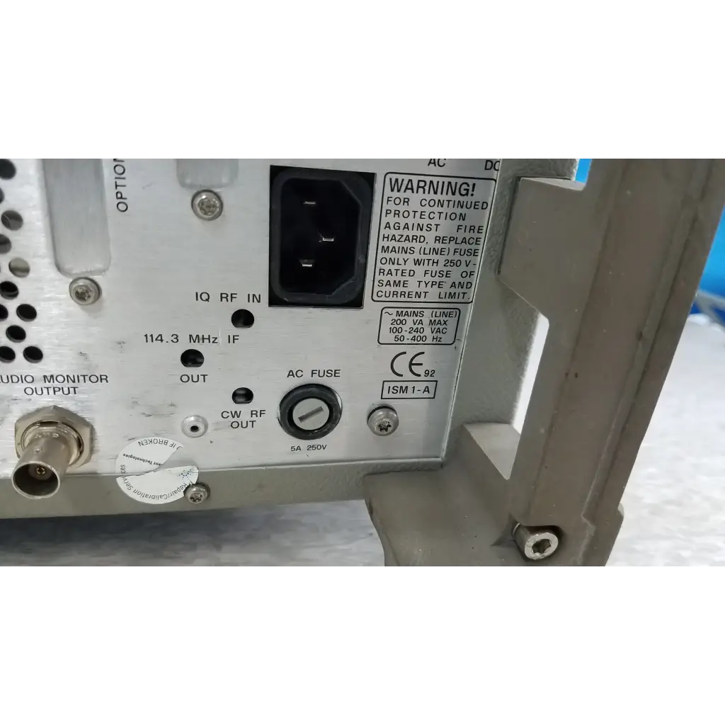 Back side of gray metallic hewlett packard 8920a communications test set with labeled rf connectors and black power port