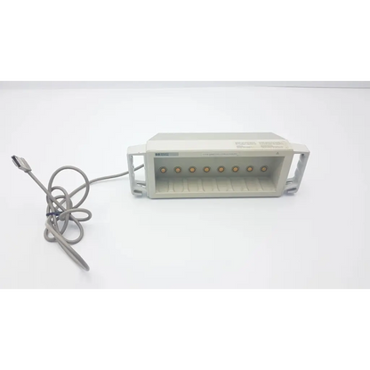 Gray plastic back rack-mounted hp m1041a intellivue information center module with six circular ports and coiled cable