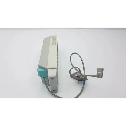 Gray and teal plastic m1041a intellivue information center module rack with coiled gray cable attached visible from the back side