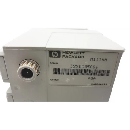 White hp m1116b patient monitor printer module showing circular port and serial number label on the back side