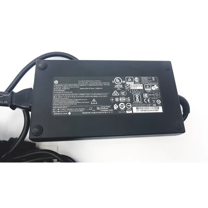 Black hp tpn-ca03 ac adapter with blue tip ad2-86 coiled cable and regulatory labels on its surface