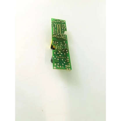 Green rectangular circuit board with silver soldered components and yellow connector for microscope power supply