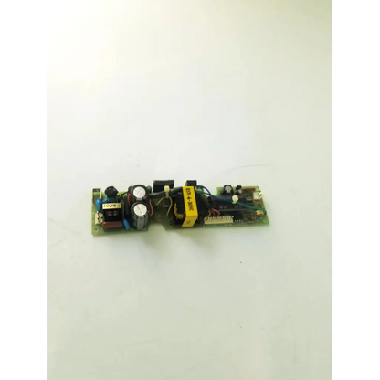 Green circuit board of hsc-6-30nc microscope power supply with black capacitors and yellow-wrapped transformer