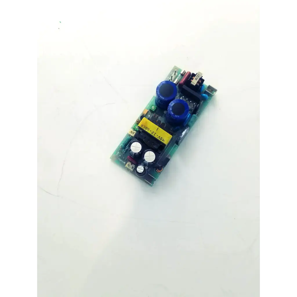 Green circuit board with blue capacitors and yellow label for hsv-12-50l control board use in electronic control systems