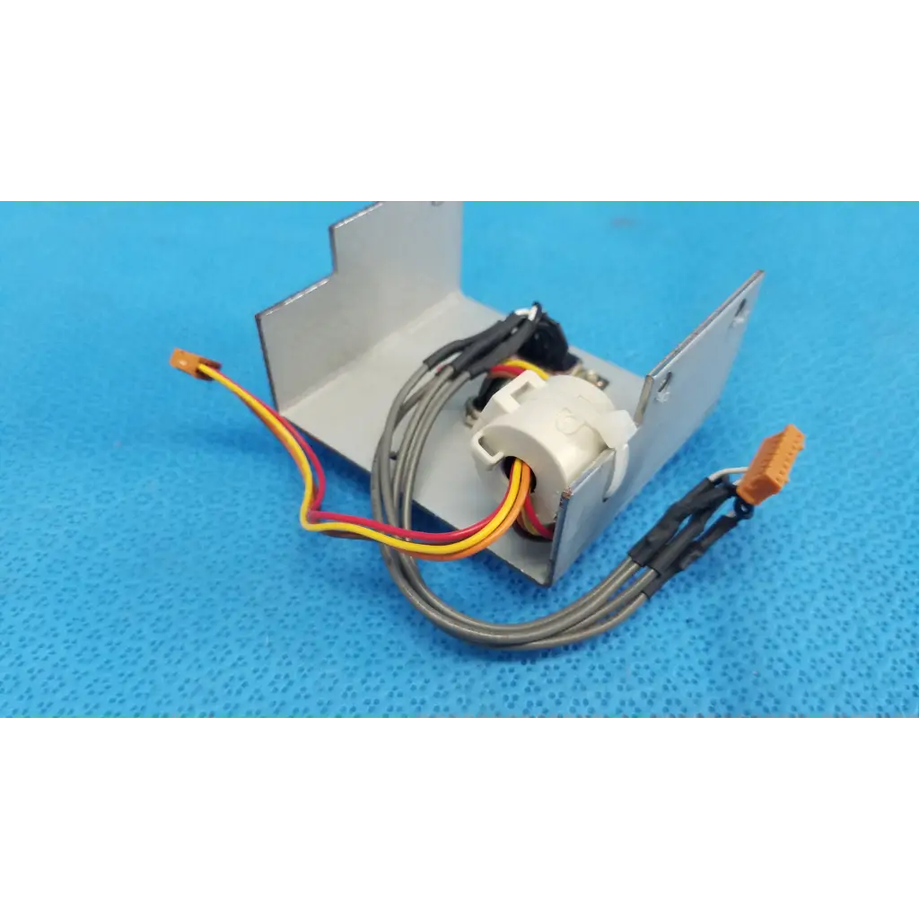 Silver metallic data port interface panel with white plastic component and multi-colored wiring for topcon retinal camera