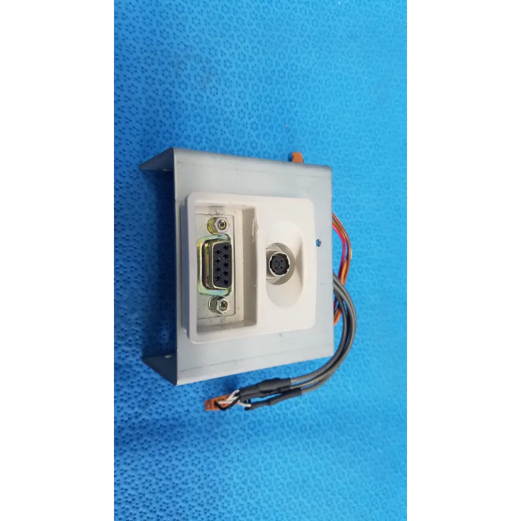 White plastic interface panel with db9 and mini-din connectors and multicolored wires for topcon trc-nw6s retinal camera