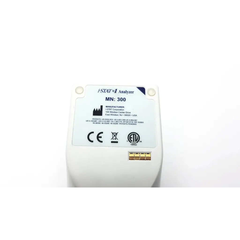 White plastic i-stat 1 analyzer blood hematology portable 300 with gold electrical contacts and manufacturer label visible