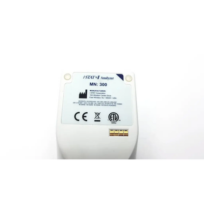 White plastic istat analyzer blood hematology portable device with gold-colored electrical contacts for blood hematology use